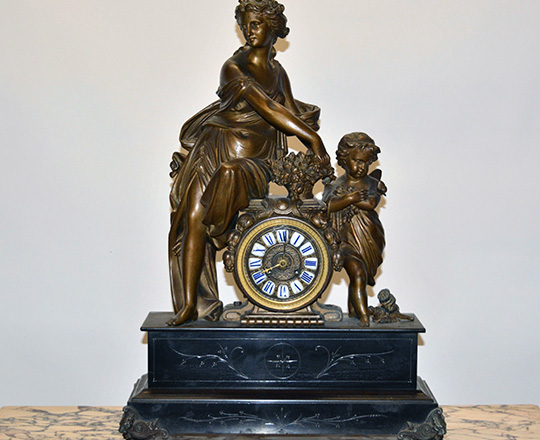 Lot 127: Large 19th cent Nap.lll black marble mantel clock with bronze wash spelter statue of woman and child. H64,5xW47cm.