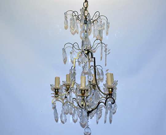 Lot 138: Early cent six light crystal and brass three stage cage chandelier. H93cm