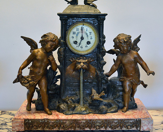 Lot 159_1: 19th c bronze wash spelter clock garniture of two puttis by fountain (of youth?) H41cm and lidded vases H39cm