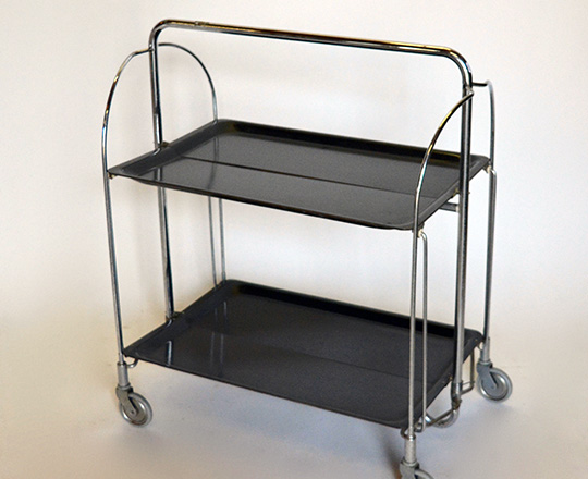 Lot 183: 50's/60's folding bar cart with two platters by Gerlinol. 41 x 60,5cm (platter only).