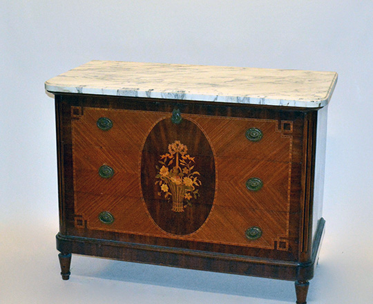 Lot 205: Late 19th cent Louis XVI three drawer, marble top commode with floral marquetry center medallion. H86xW112xD55cm.