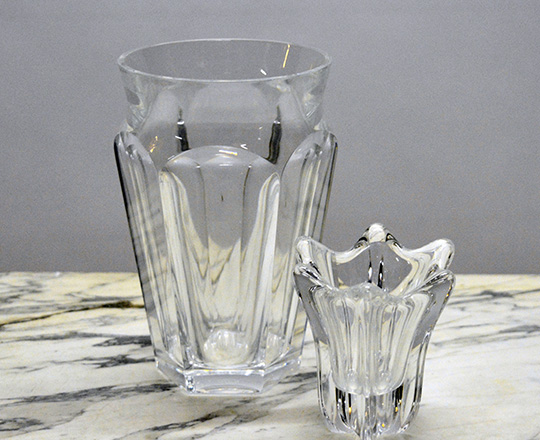 Lot 219: Baccarat crystal six facet round vase, H 17,5cm and a small Daum vase H 9cm.