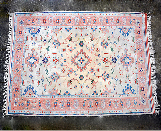 Lot 245: Oriental wool carpet; 250 x 185cm.