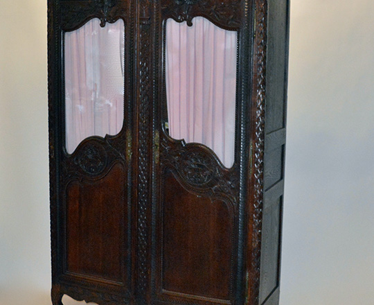 Lot 280: 19th cent finely sculpted Normandy two door dark oak armoire; top half vitrine. H214xW144xD56cm.