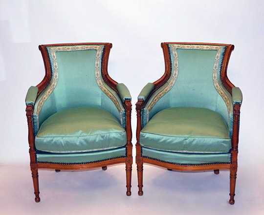 Lot 321: Pair Directoire style bergeres covered in green pastel silk(?)