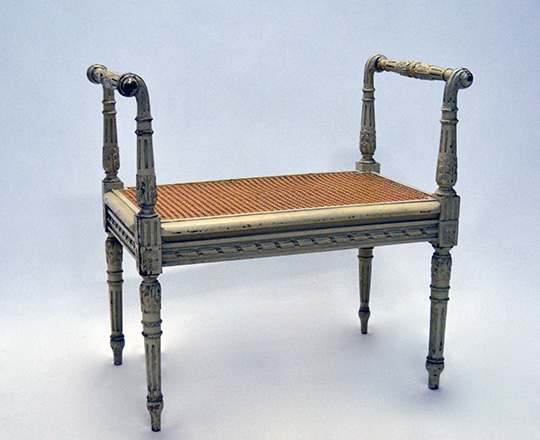 Lot 322: Turn cent Louis XVI painted piano chair with caned seat and arm rest. W65 x D41cm.