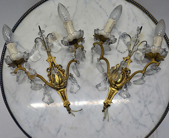 Lot 344: Pair two light gilt brass, crystal wall sconces.
