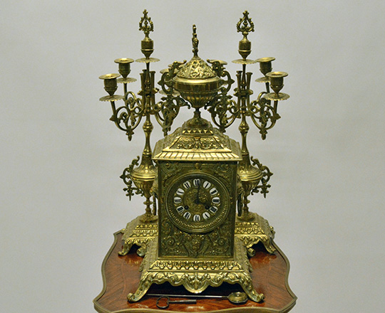 Lot 346: 19th c gilt bronze three piece Louis XIV clock garniture sided by pair five light candelabras.