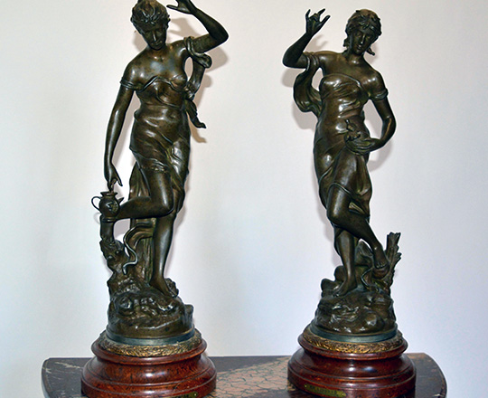 Lot 347: Two large turn cent, bronze wash spelter female statues; ''La liberte'' & ''La surprise''. H 57cm.