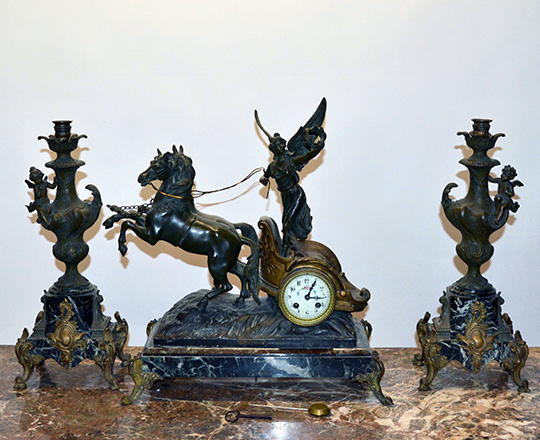 Lot 361: Fairly large bronze wash spelter mantle clock; ''Victort'' racing with horses on a chariot. F.Moreau. H51xW545cm.