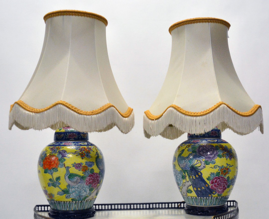 Lot 365: Pair glazed ceramic Chinese lidded vases / lamps with colorful animal and floral decor on yellow background. H