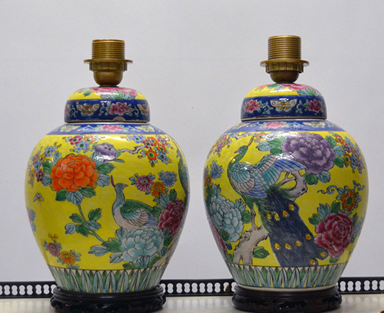 Lot 365_1: Pair glazed ceramic Chinese lidded vases / lamps with colorful animal and floral decor on yellow background. H