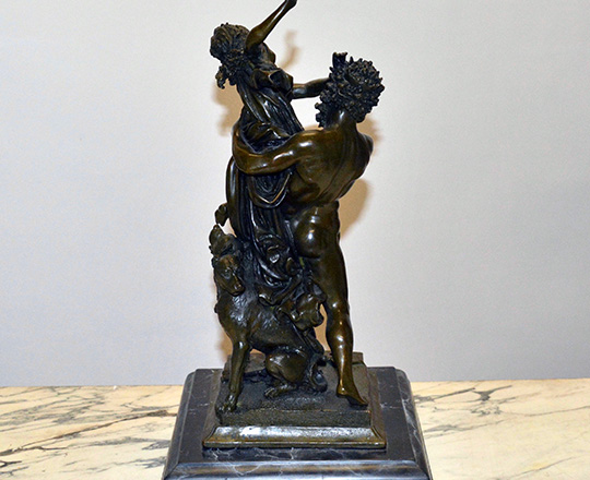 Lot 386_1: Dark medal color bronze statue of woman captured by faun. H 38 cm.