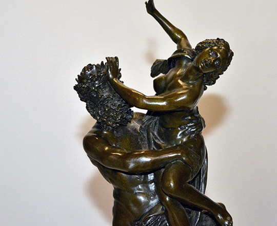Lot 386_2: Dark medal color bronze statue of woman captured by faun. H 38 cm.