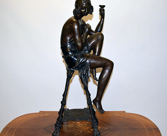 Lot 389_1: Large bronze sculpter of (1920's Oriental?) woman on a stool with a cup. H 82cm.