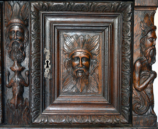 Lot 405_4: 17th cent well restored two stage oak cabinet on a console base with finely carved faces on top section. H139xW101xD57cm.