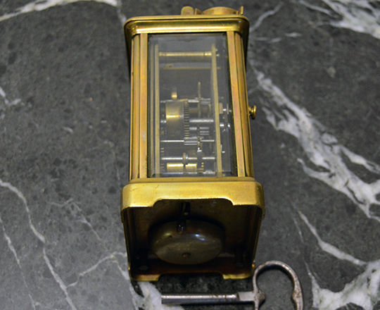 Lot 422_2: 19th cent bronze travel clock with alarm setting. H14,4xW8xD6,5cm.