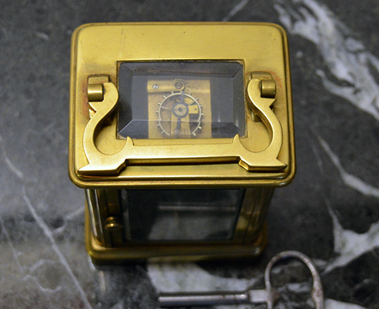Lot 422_3: 19th cent bronze travel clock with alarm setting. H14,4xW8xD6,5cm.