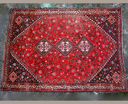 Lot 439: Oriental red wool carpet. ? X 217cm.