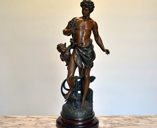 Lot 498: Turn cent bronze wash spelter statue of man representing 'Industry'. H62cm.