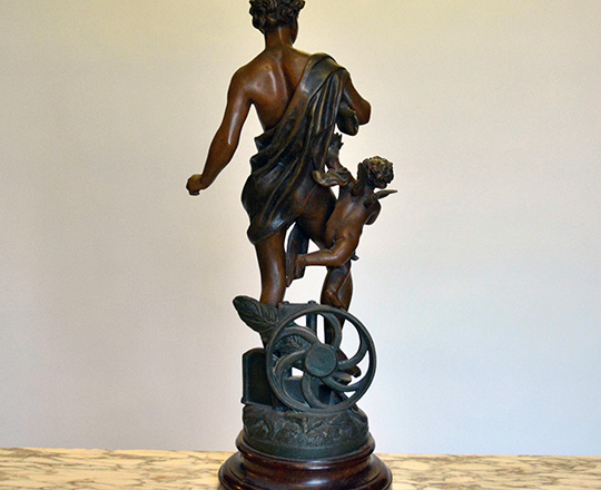 Lot 498_1: Turn cent bronze wash spelter statue of man representing 'Industry'. H62cm.