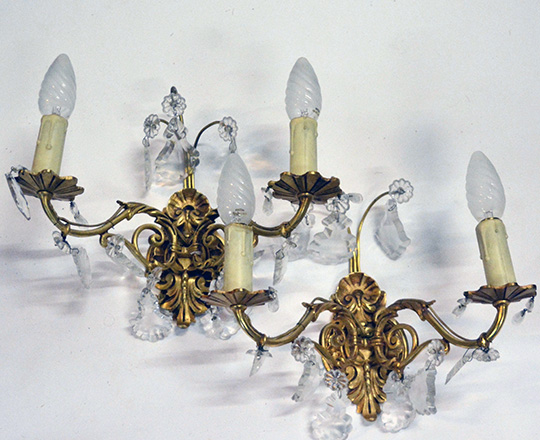 Lot 519: Pair gilt bronze two light crystal wall sconces. H25 x W30cm.