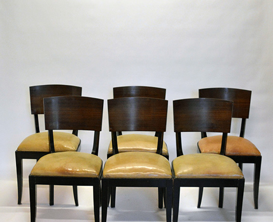 Lot 523: Set of six black laquered Art Deco leather covered seat chairs with Macassar ebony back.