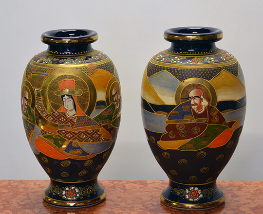 Lot 570: Pair Satsuma vases decorated with various hand painted Japanese characters. H31cm.