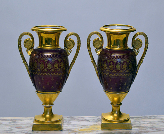 Lot 583_1: Pair 19th cent gilt porcelain vases with paited family scenes. H 30cm.