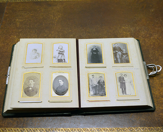 Lot 68: 19th cent large green leather bound photo album (with photos).