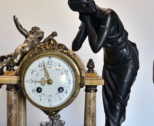 Lot 71_1: 19th cent Louis XVI portico clock,H42cm. garniture with bronze patinated spelter statue of lady & pr. gilt lidded vases,H37cm.