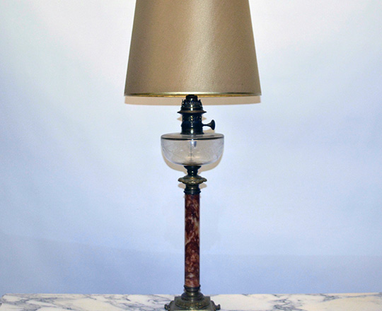 Lot 74: Tall turn cent marble column (elec.) oil lamp on a bronze base. H 60cm.