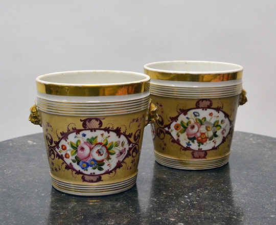 Lot 93: Pr 19th cent Nap.lll plant vases with floral and gilt decor. H14,5x dia.14,5cm.